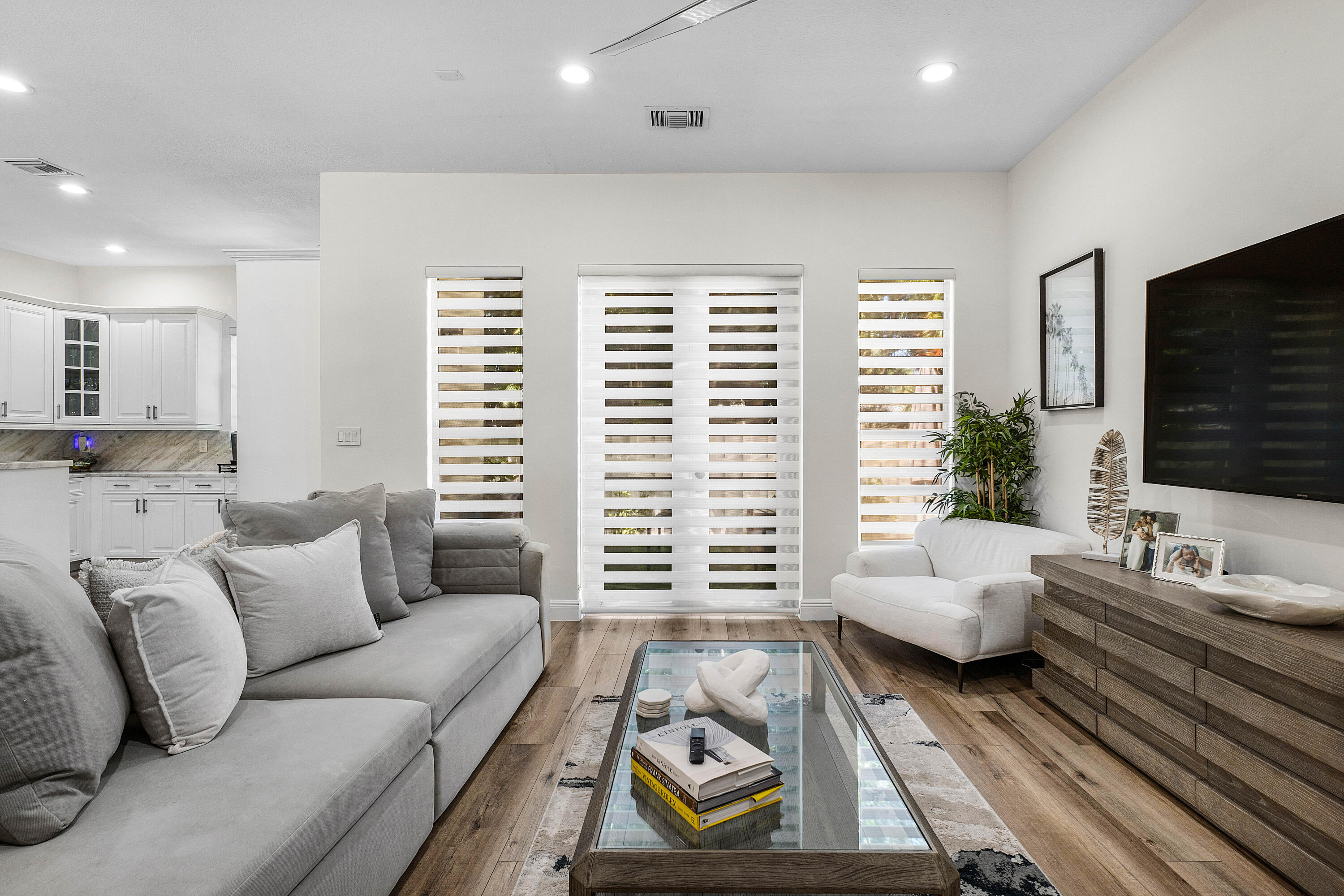121 Via Poinciana Lane Boca Raton, FL 33487 - Photo 19 of 59 a living room with furniture and a flat screen tv