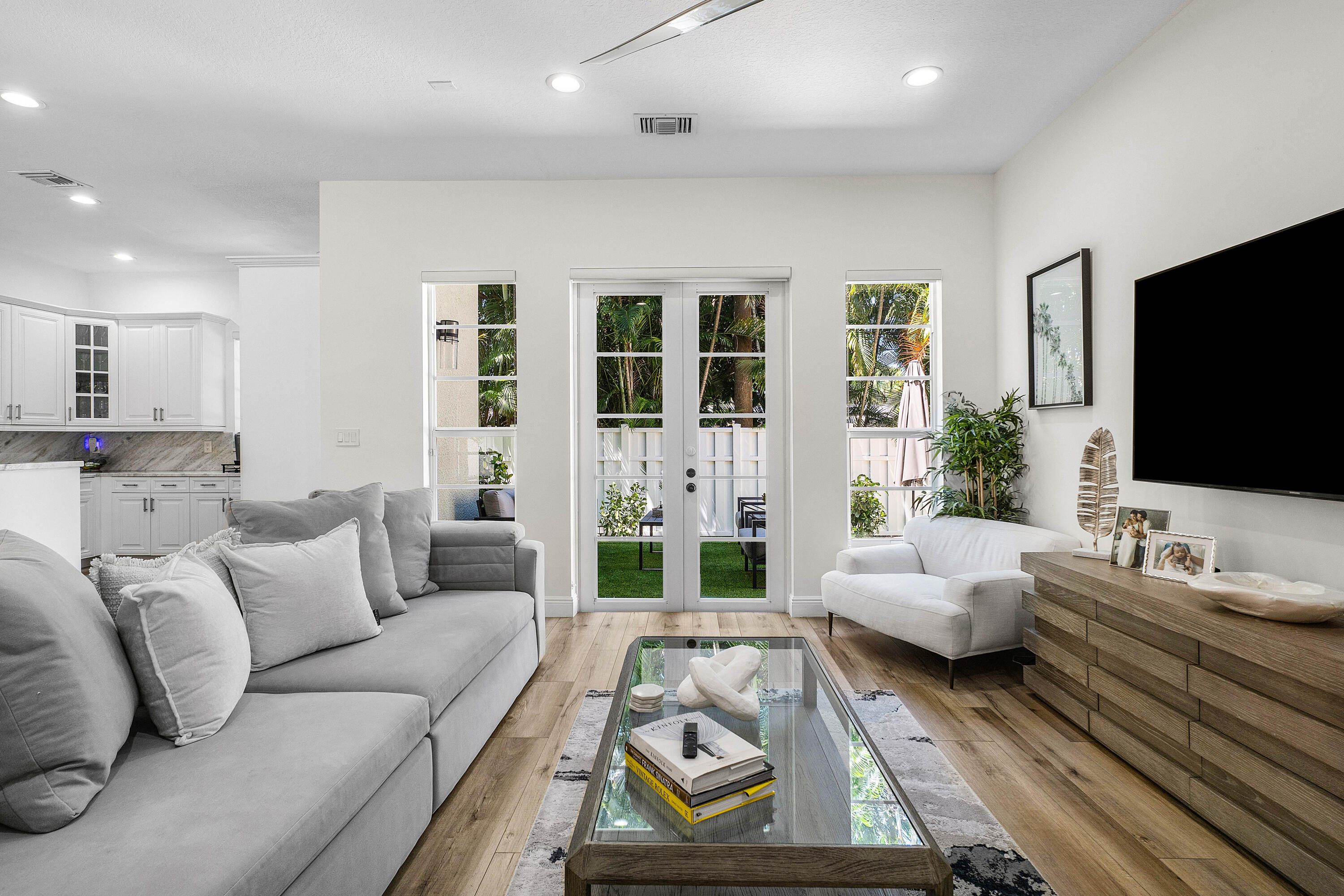 121 Via Poinciana Lane Boca Raton, FL 33487 - Photo 20 of 59 a living room with furniture and a flat screen tv