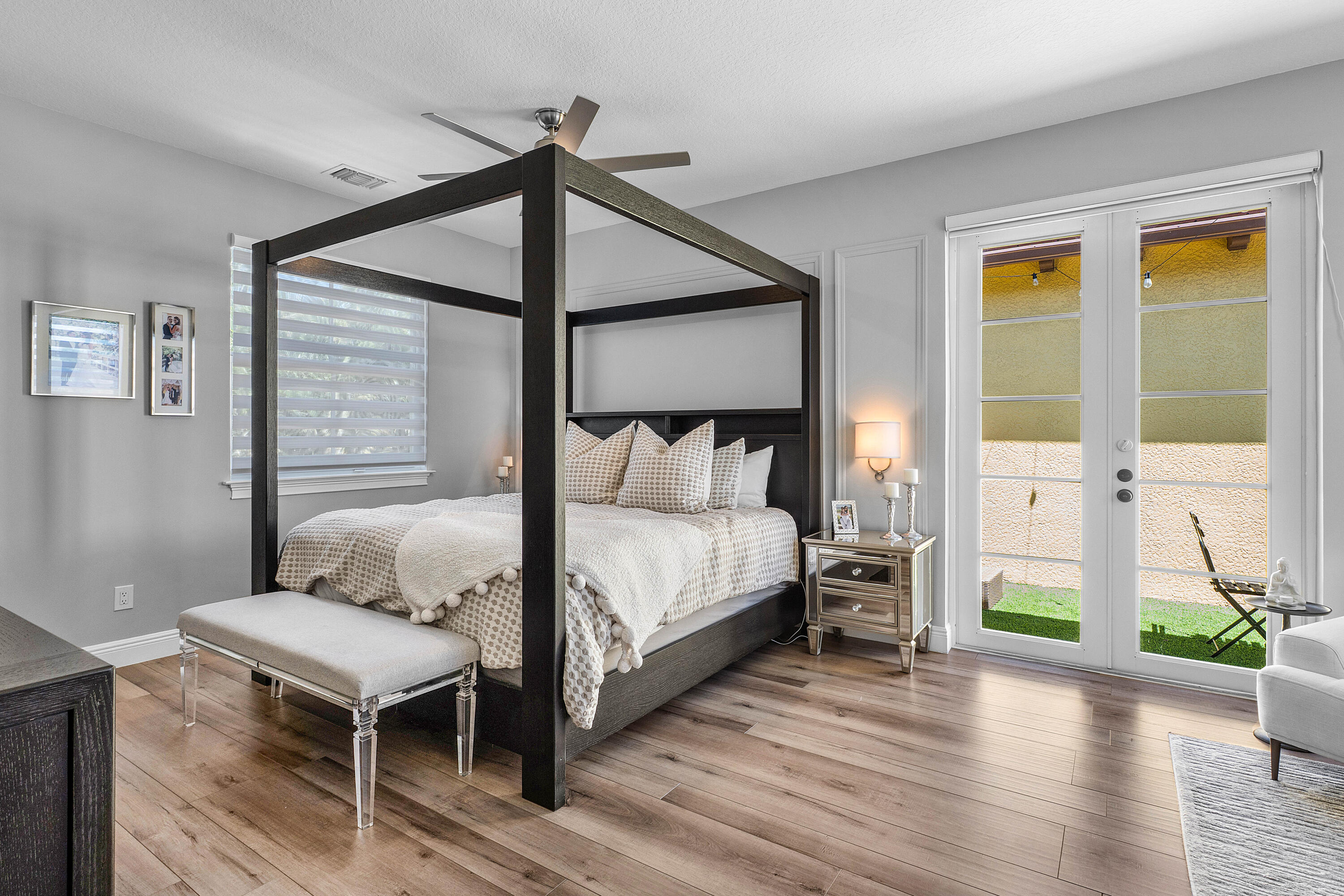 121 Via Poinciana Lane Boca Raton, FL 33487 - Photo 28 of 59 a bedroom with a bed and wooden floor