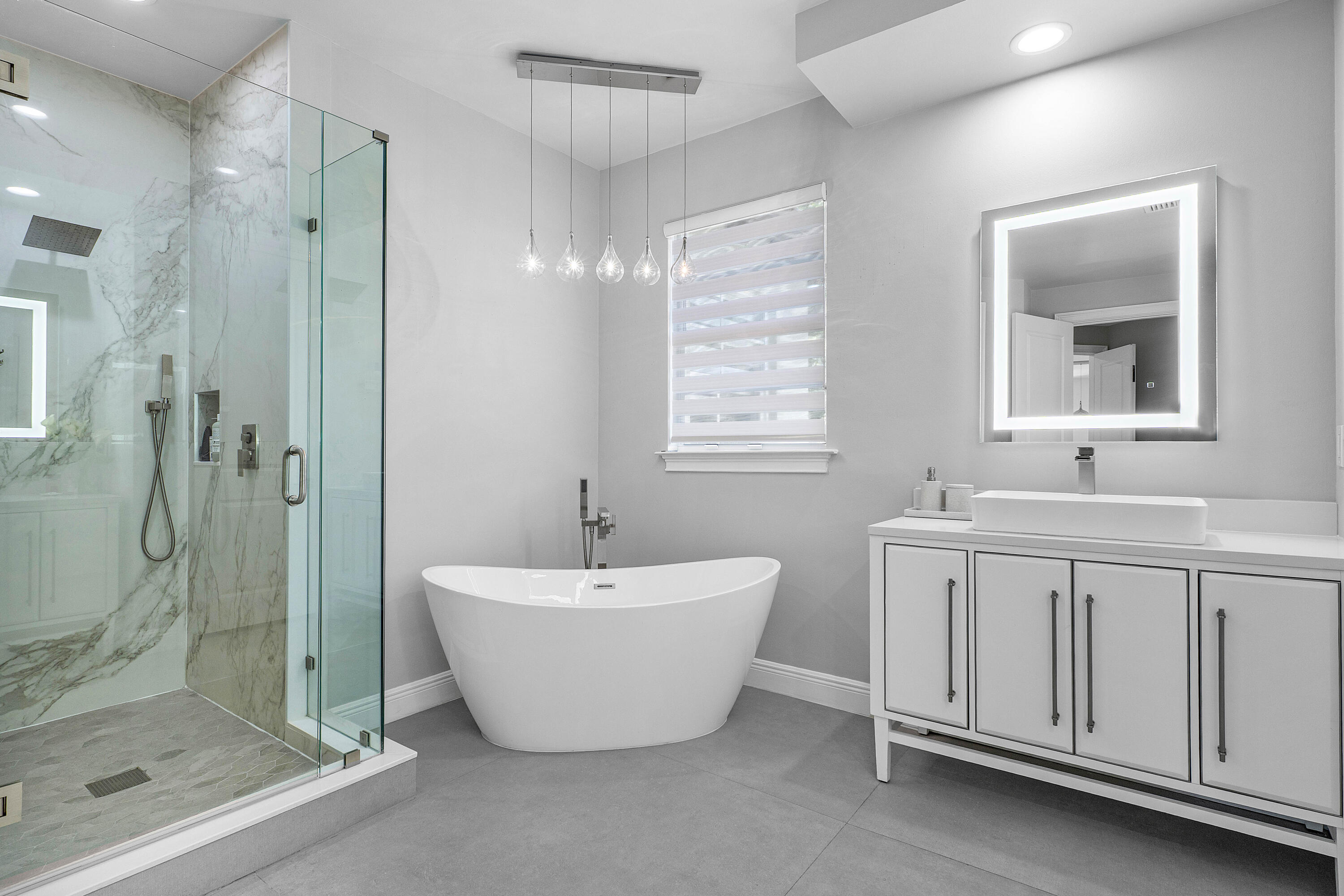 121 Via Poinciana Lane Boca Raton, FL 33487 - Photo 30 of 59 a spacious bathroom with a double vanity sink mirror and shower