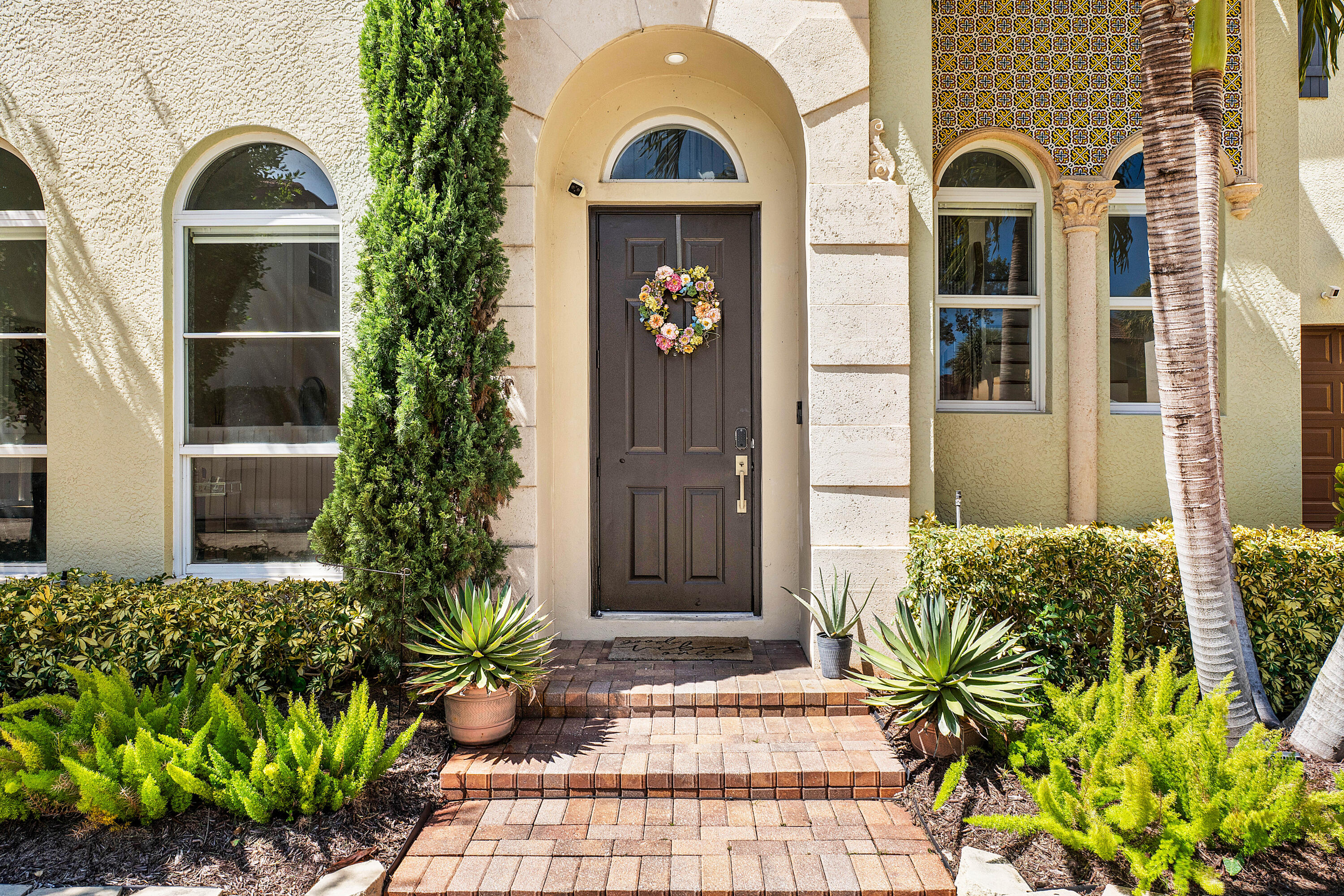 121 Via Poinciana Lane Boca Raton, FL 33487 - Photo 5 of 59 a front view of a house