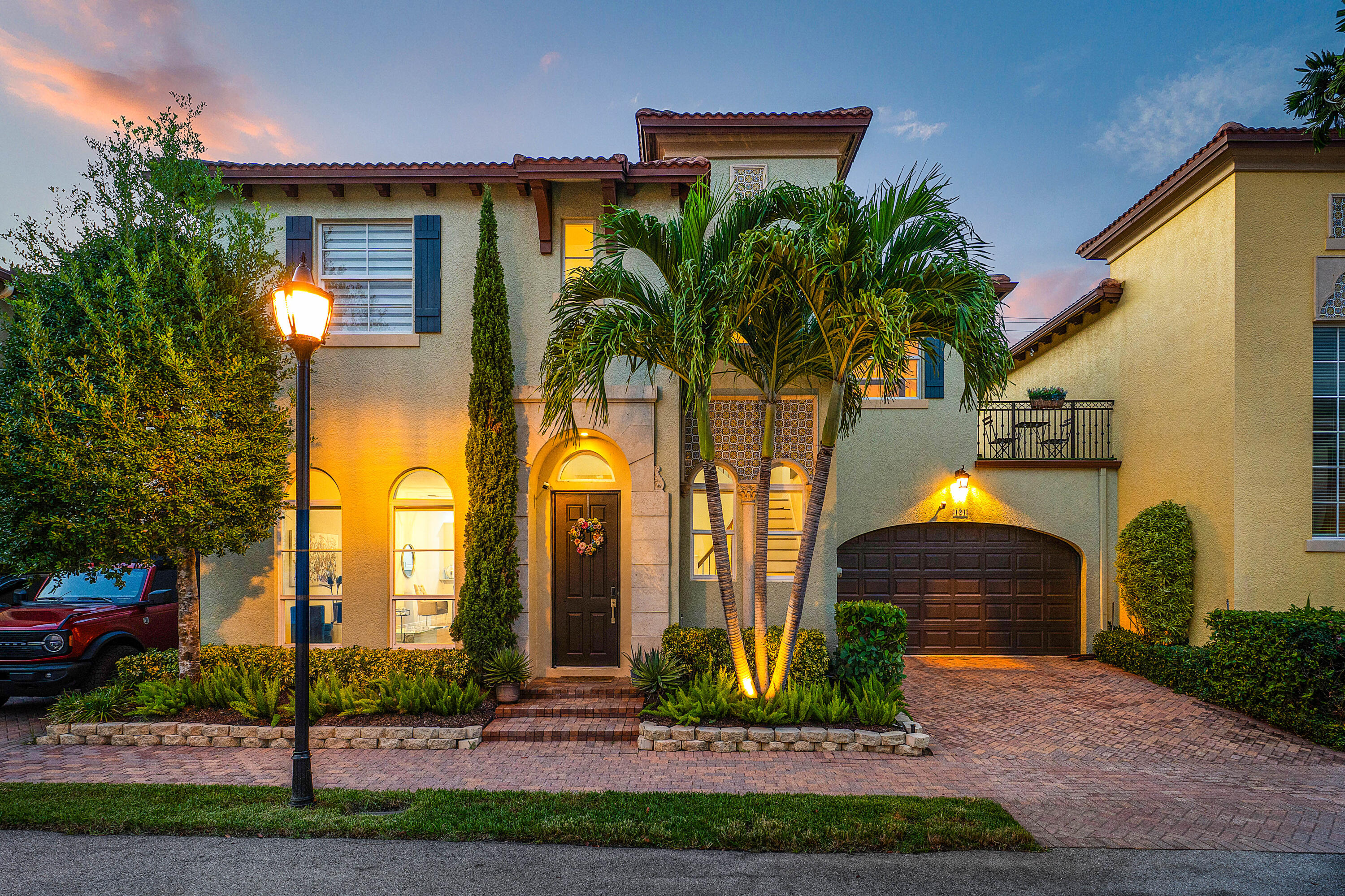 121 Via Poinciana Lane Boca Raton, FL 33487 - Photo 51 of 59 a front view of house with yard and green space