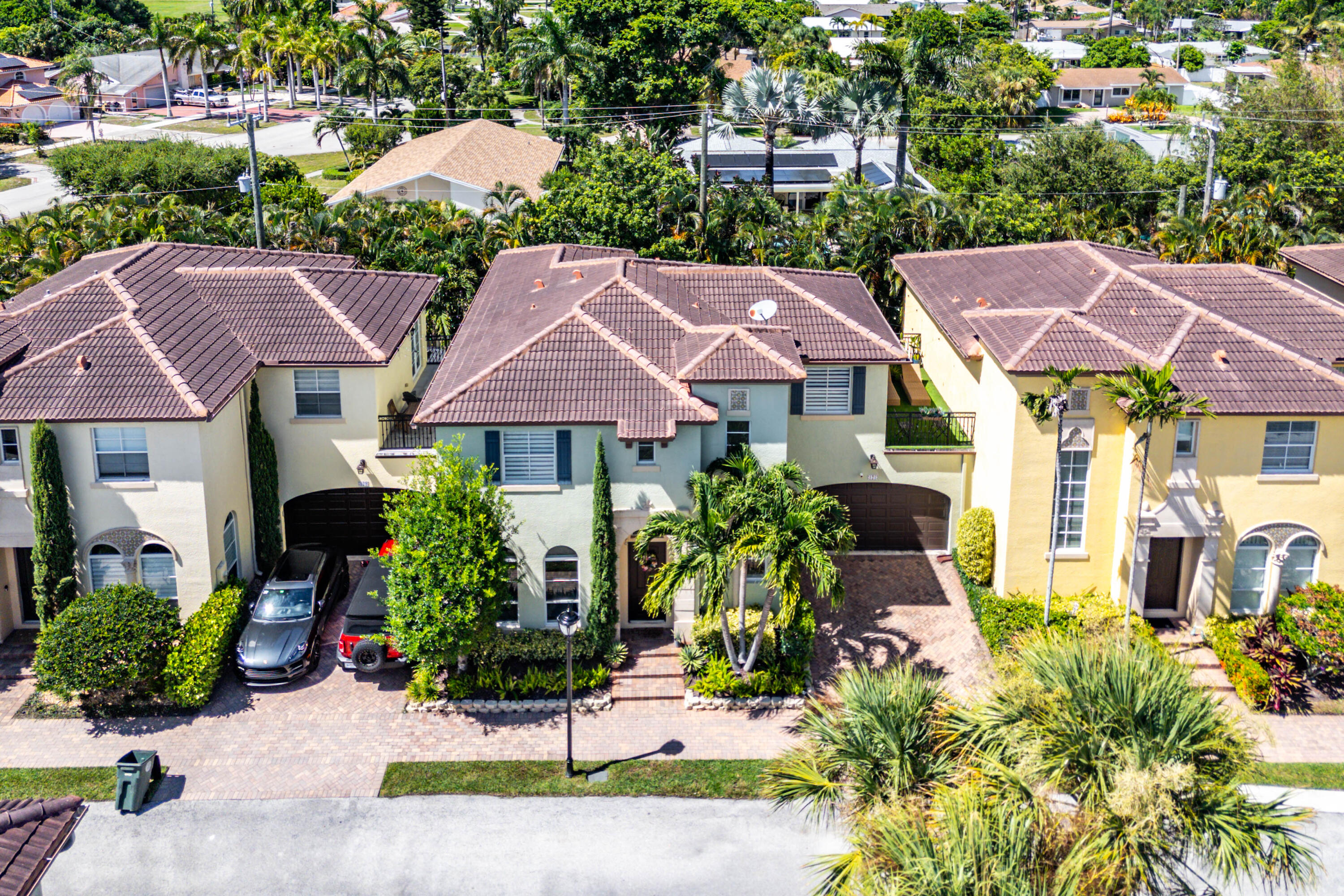 121 Via Poinciana Lane Boca Raton, FL 33487 - Photo 58 of 59 a house with lots of trees in the background