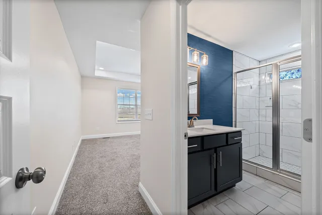 a view of a bathroom from a hallway