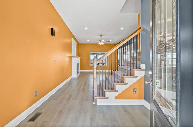a view of entryway with wooden floor