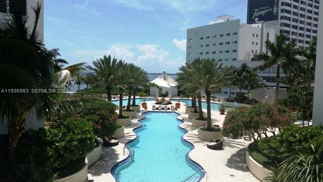 253 Northeast 2nd Street, Unit 4303 Miami, FL 33132 - Photo 23 of 35 a view of a swimming pool with outdoor seating and plants