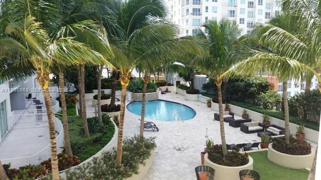 253 Northeast 2nd Street, Unit 4303 Miami, FL 33132 - Photo 24 of 35 a view of a backyard with plants and patio