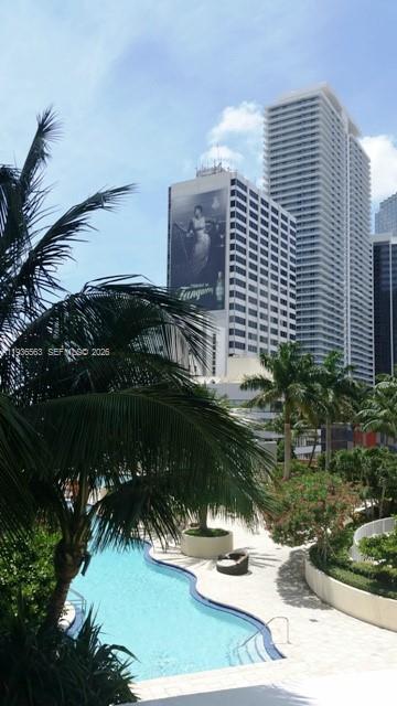 253 Northeast 2nd Street, Unit 4303 Miami, FL 33132 - Photo 25 of 35 a view of swimming pool with a yard and plants