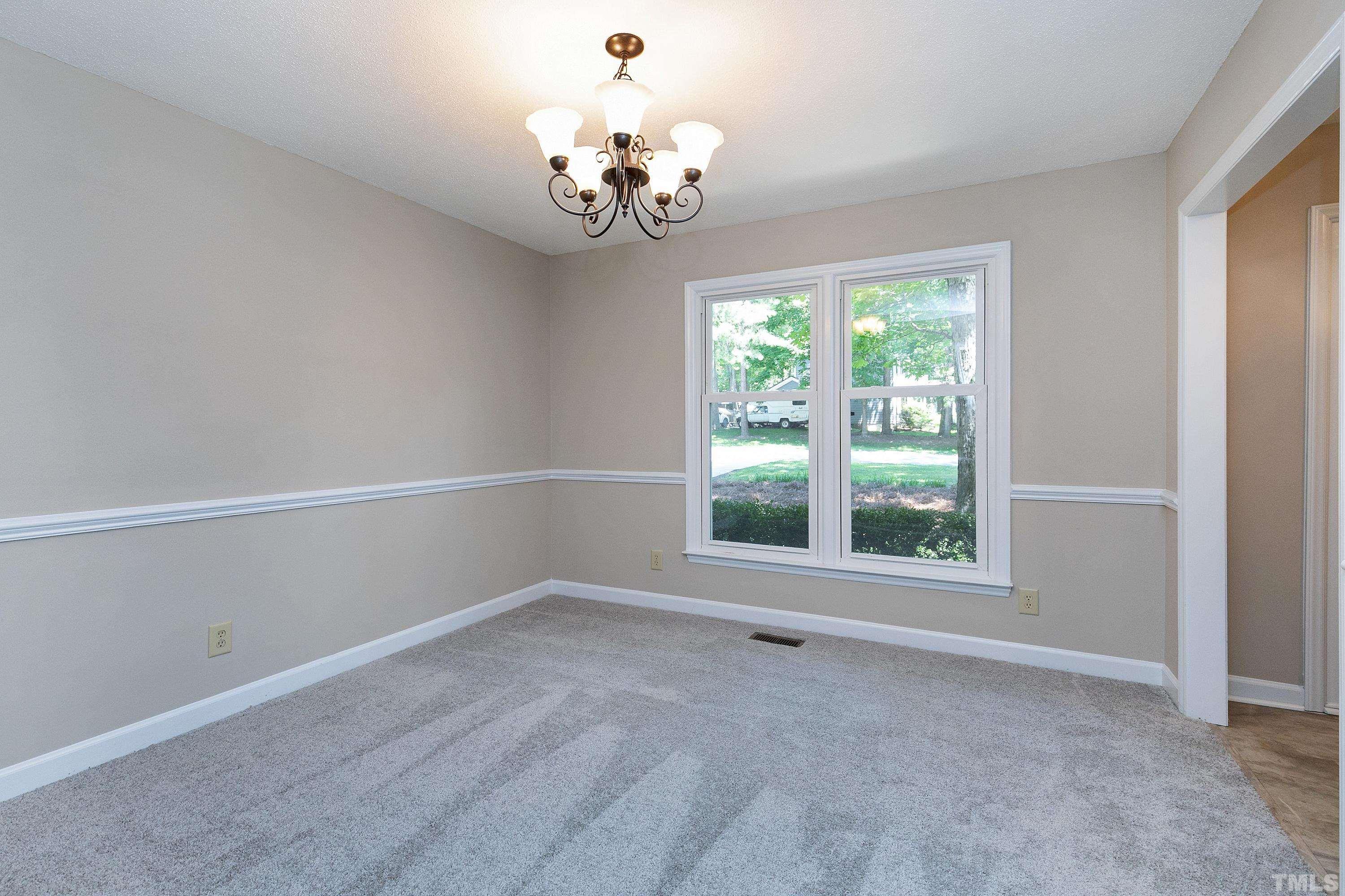 1104 Apache Lane Apex, NC 27502 - Photo 12 of 29 a view of an empty room with a window