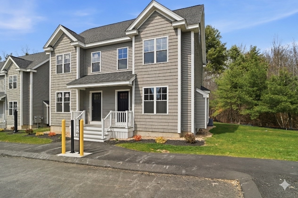 21 Ambrose Way, Unit 21 Shirley, MA 01464 - Photo 1 of 31 a front view of a house with a yard