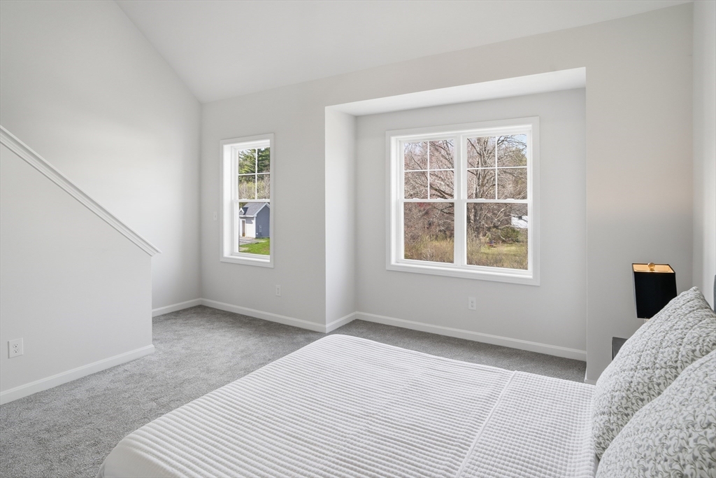 21 Ambrose Way, Unit 21 Shirley, MA 01464 - Photo 20 of 31 a bedroom with a bed and a window