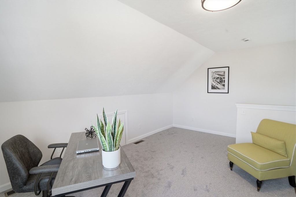 21 Ambrose Way, Unit 21 Shirley, MA 01464 - Photo 22 of 31 a view of a livingroom with furniture and a potted plant