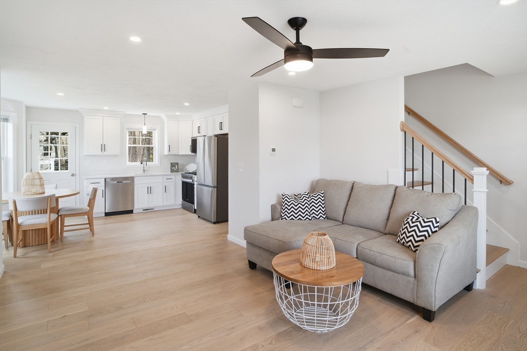 21 Ambrose Way, Unit 21 Shirley, MA 01464 - Photo 5 of 31 a living room with furniture and kitchen view