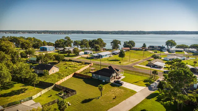an aerial view of residential houses with outdoor space