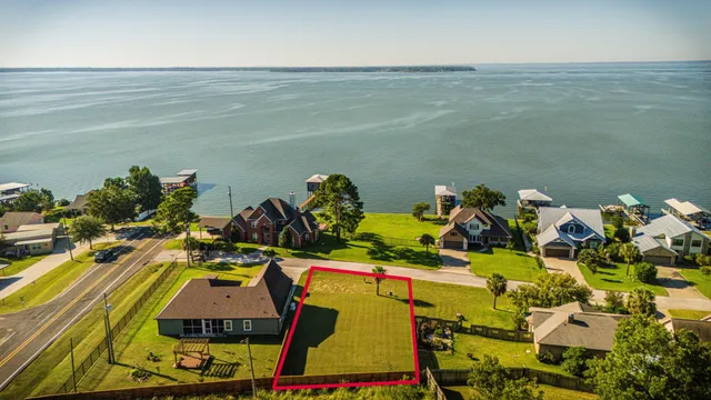 an aerial view of a house with a swimming pool