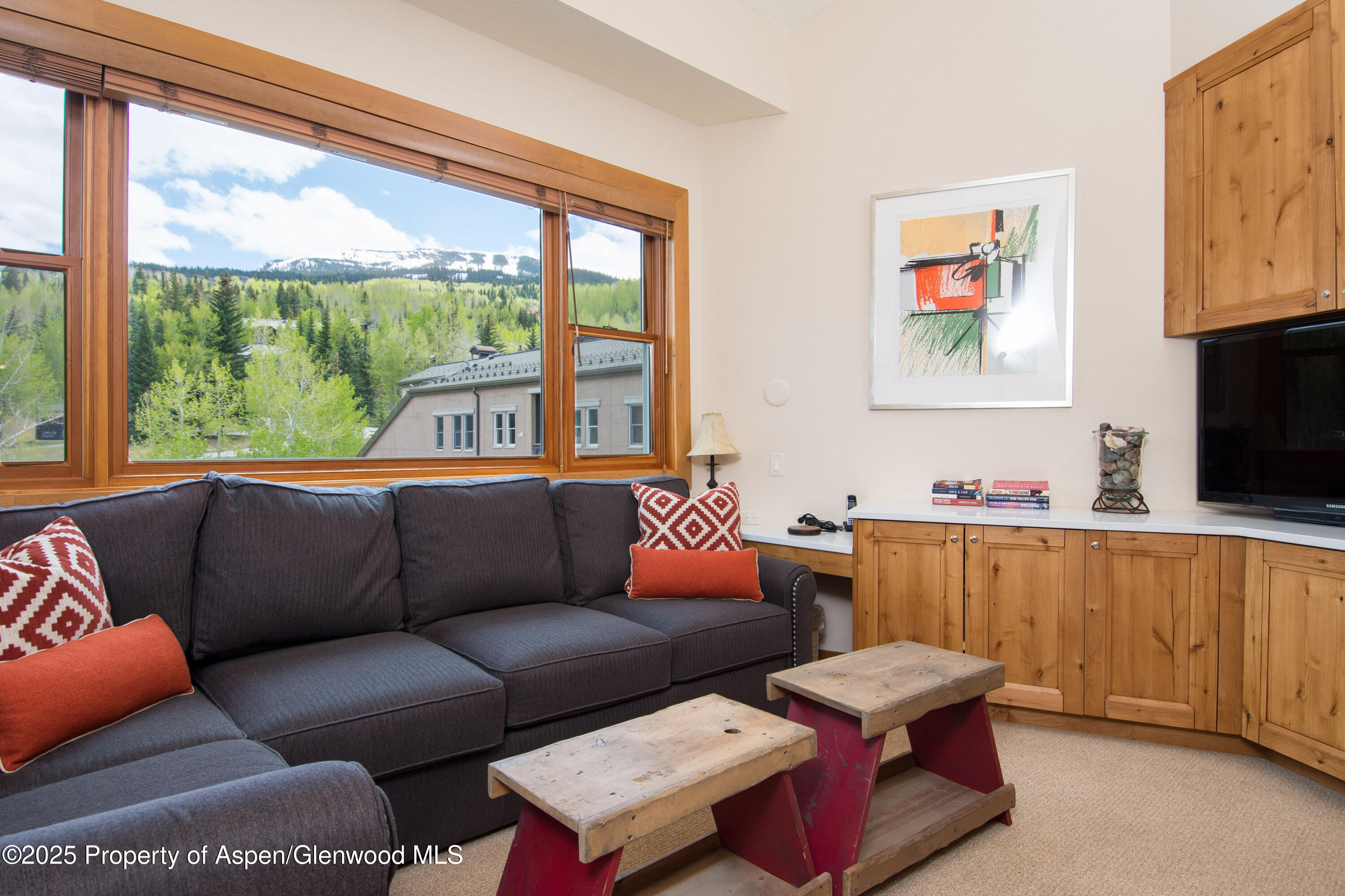 425 Wood Road, Unit 48 Snowmass Village, CO 81615 - Photo 23 of 41 a living room with furniture and a flat screen tv