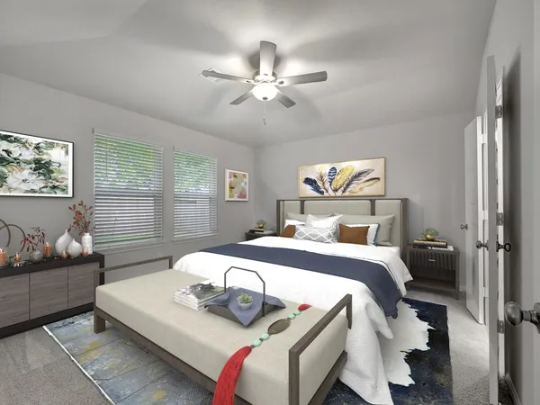 a bedroom with a bed and ceiling fan