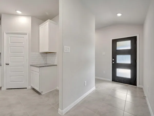 a view of cabinets and closet