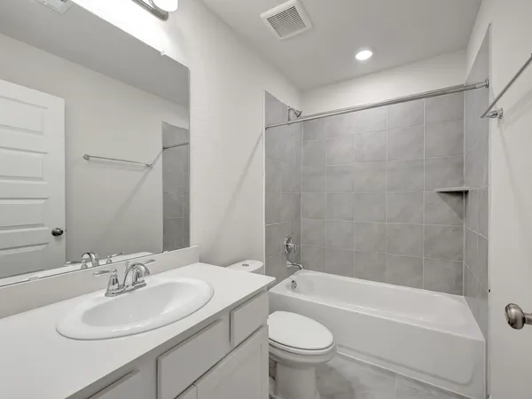 a bathroom with a sink a toilet and a bathtub