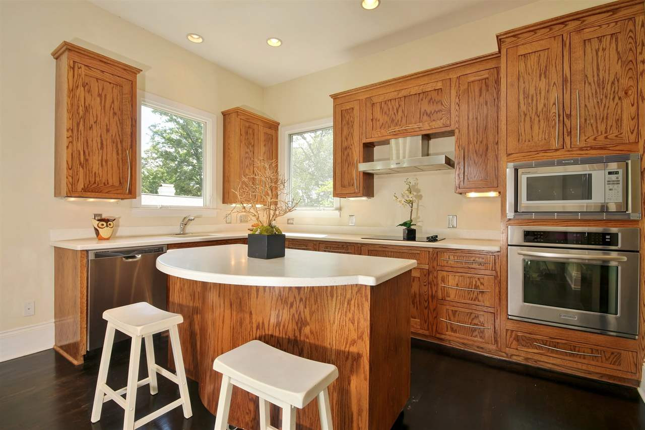 2302 Fairview Road Raleigh, NC 27608 - Photo 9 of 25 Custom, solid oak cabinets. The Island is on casters and may be moved to accommodate any size event! Kitchen