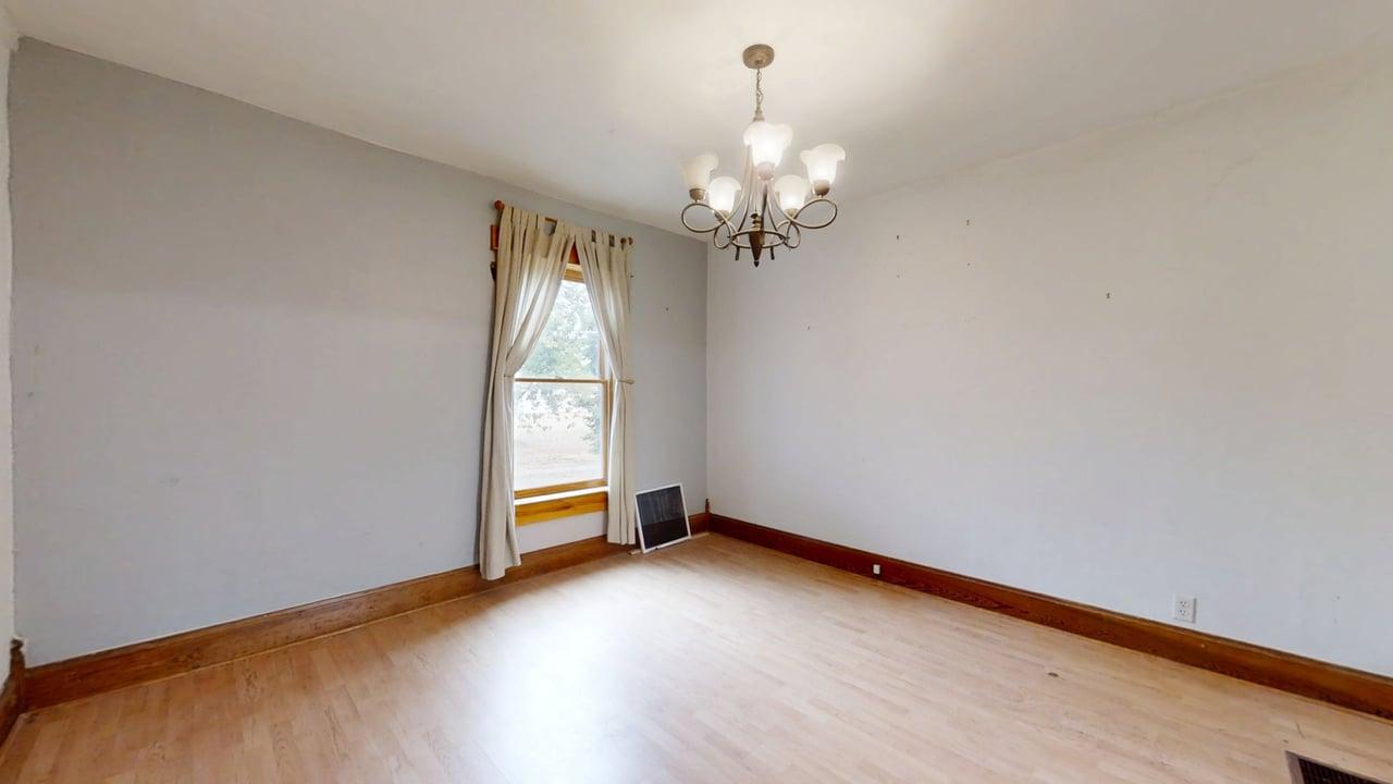 320 North Main Street Gifford, IL 61847 - Photo 13 of 42 a view of empty room with wooden floor and fan
