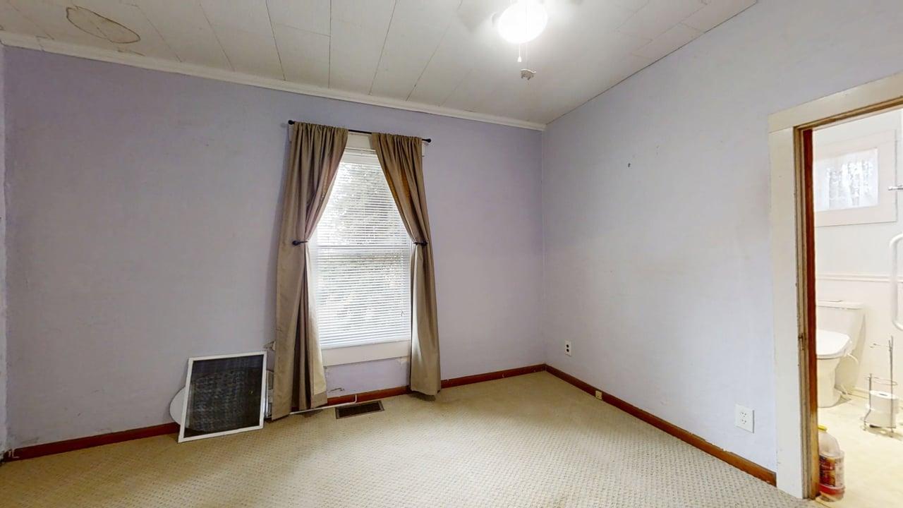 320 North Main Street Gifford, IL 61847 - Photo 20 of 42 an empty room with window