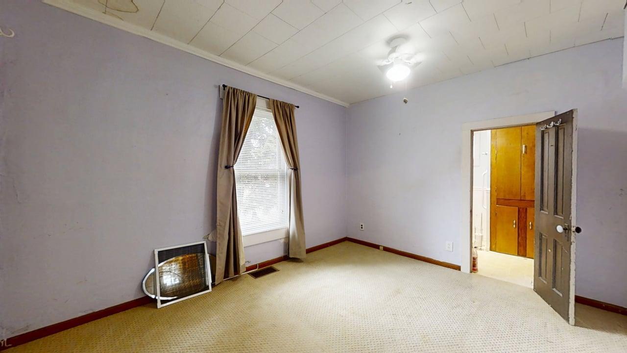 320 North Main Street Gifford, IL 61847 - Photo 21 of 42 an empty room with windows