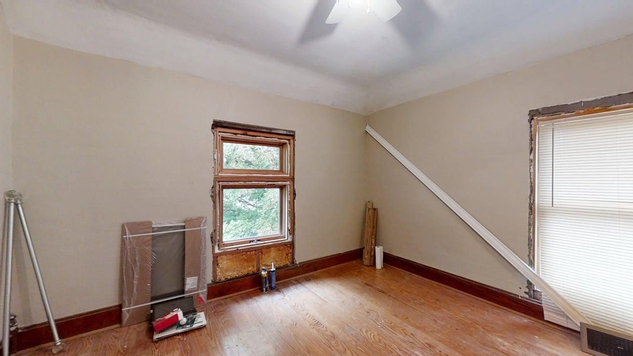 320 North Main Street Gifford, IL 61847 - Photo 28 of 42 a view of an empty room with window and wooden floor