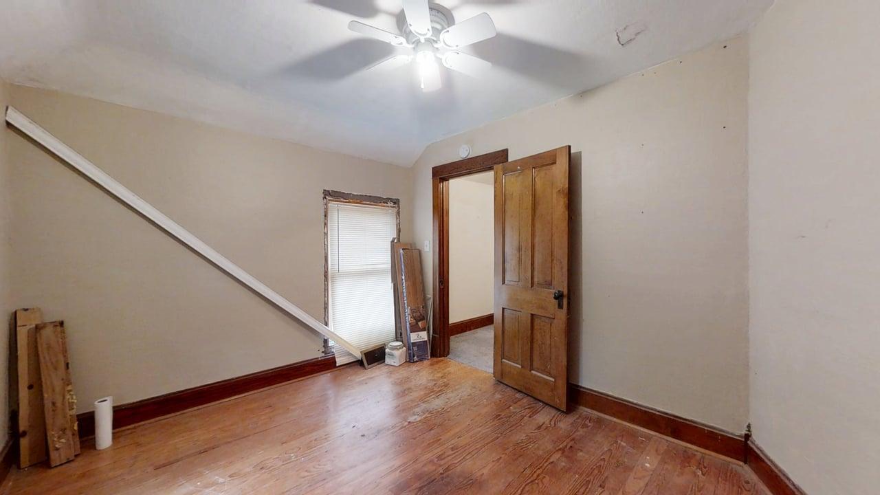 320 North Main Street Gifford, IL 61847 - Photo 29 of 42 an entryway at a hallway with a window and wooden floor