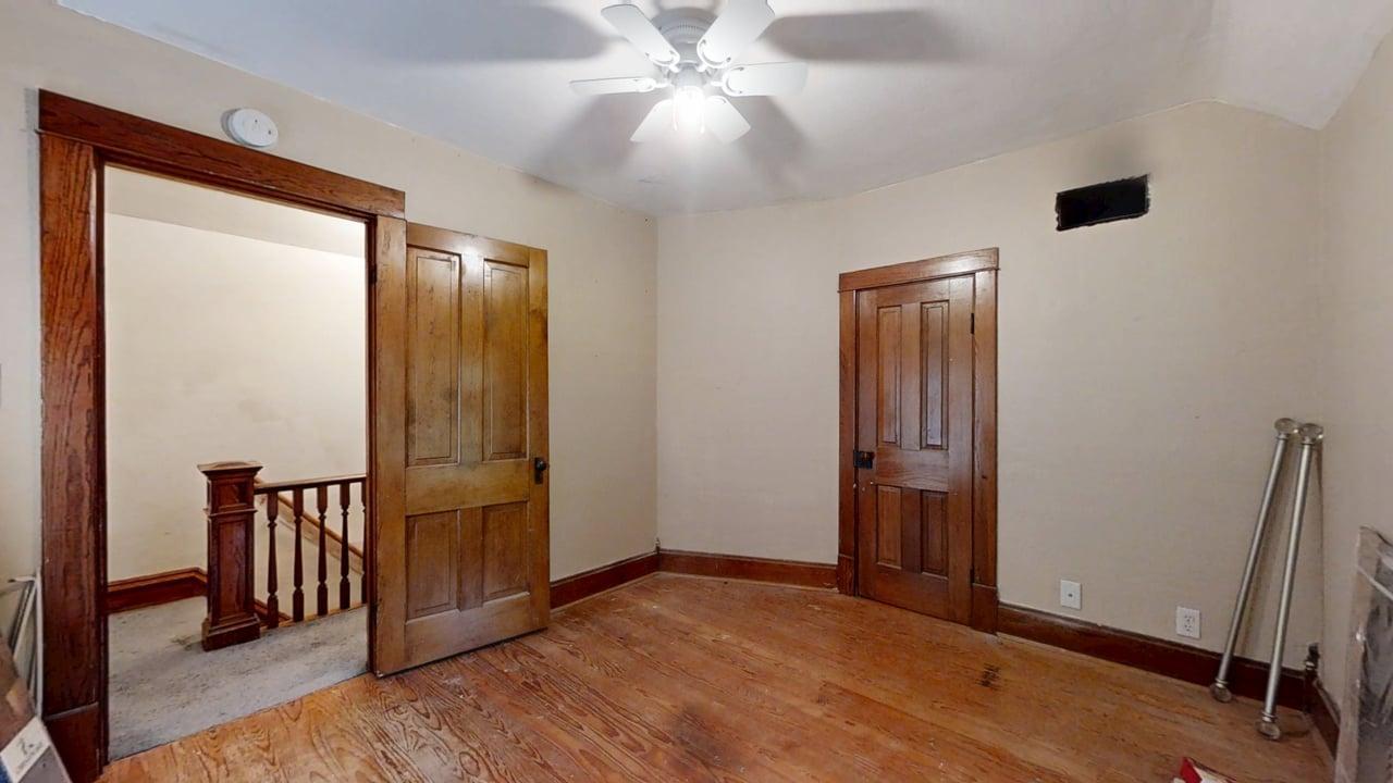320 North Main Street Gifford, IL 61847 - Photo 30 of 42 wooden floor in an empty room with a window
