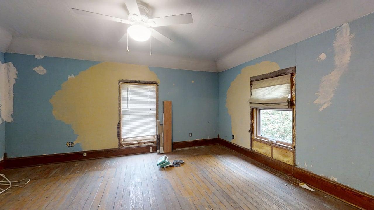 320 North Main Street Gifford, IL 61847 - Photo 31 of 42 an empty room with wooden floor and windows