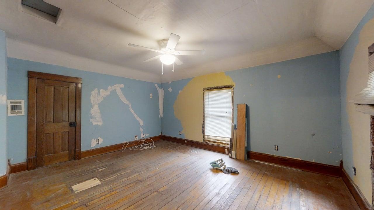320 North Main Street Gifford, IL 61847 - Photo 35 of 42 an empty room with wooden floor and window