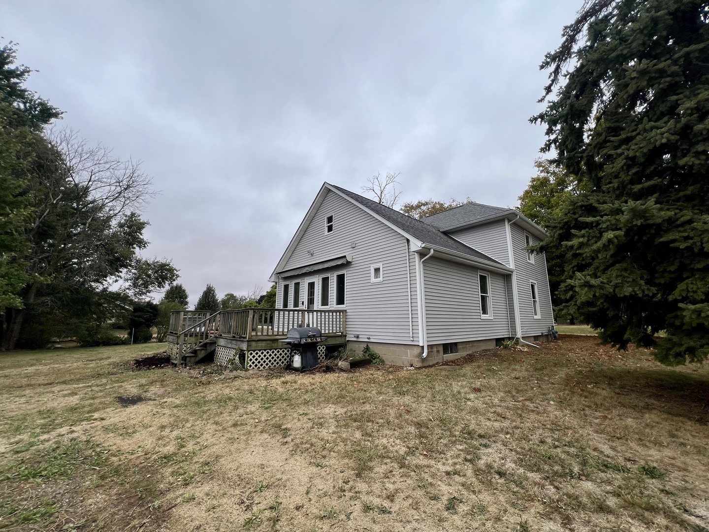 320 North Main Street Gifford, IL 61847 - Photo 39 of 42 a view of a house with a yard and tree s