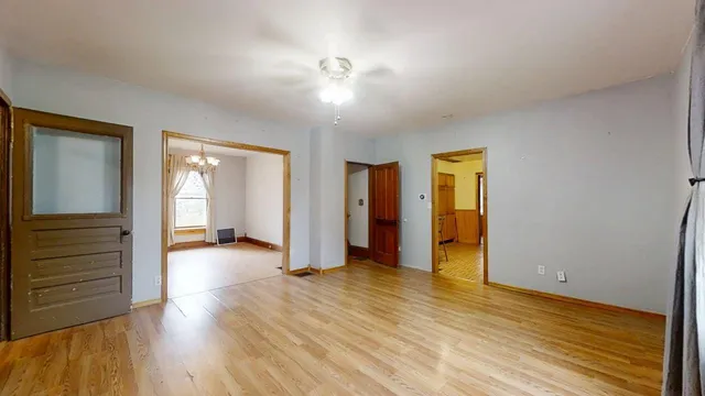 a view of a livingroom with wooden floor