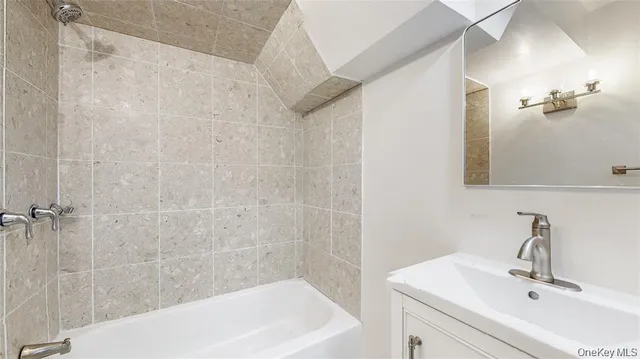a view of a kitchen with white walls and white doors