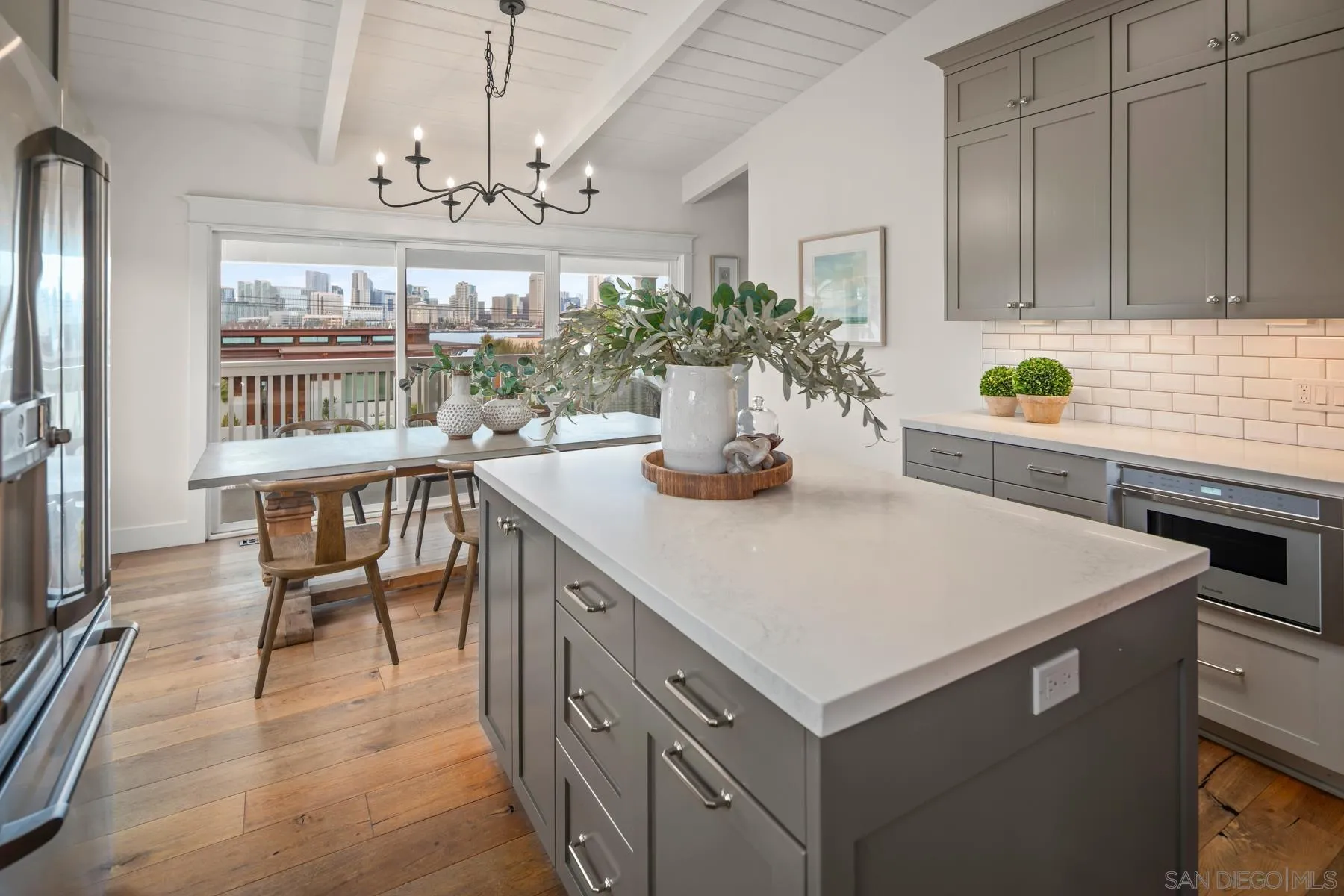 420 1st Street Coronado, CA 92118 - Photo 17 of 38 a kitchen with a table chairs stove and refrigerator