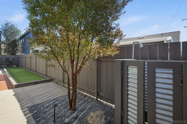 a front view of a house with tree s