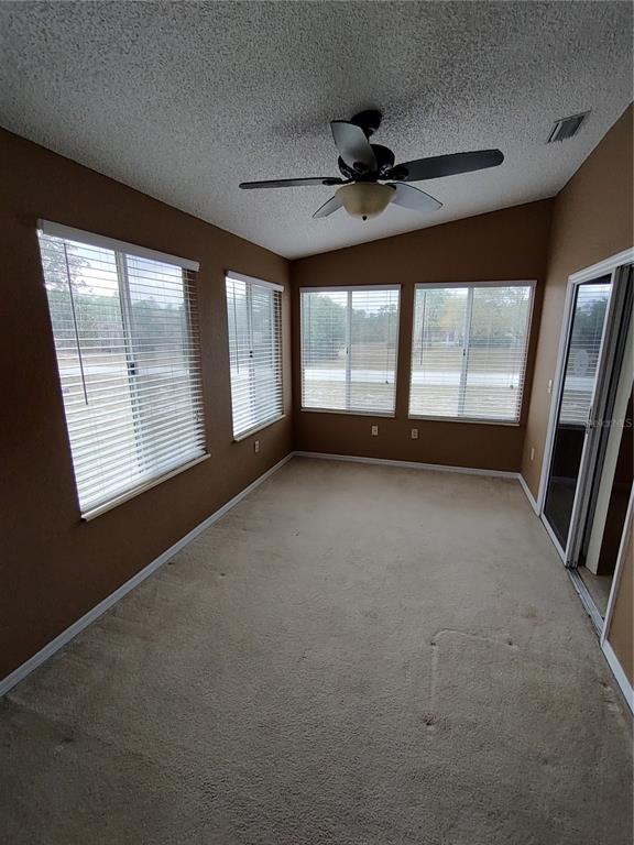 8792 Southwest 116th Place Road Ocala, FL 34481 - Photo 15 of 36 a view of an empty room with a window