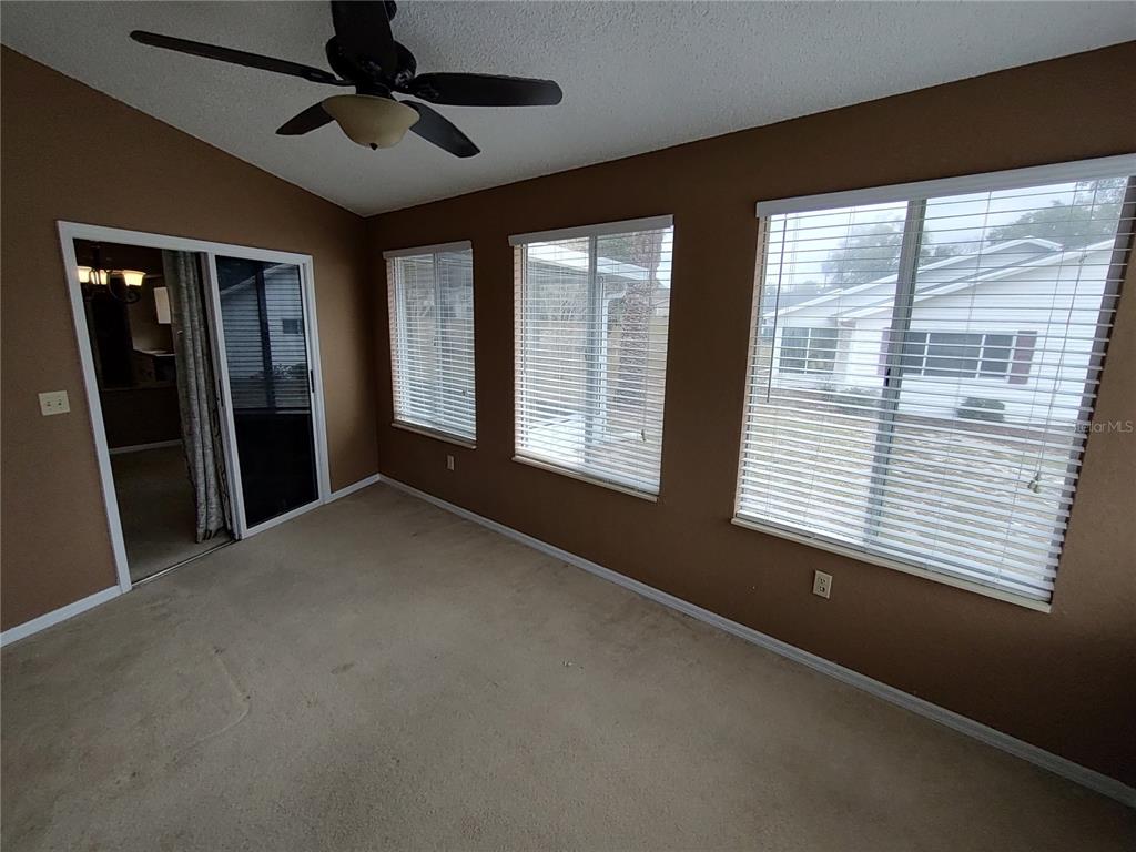 8792 Southwest 116th Place Road Ocala, FL 34481 - Photo 16 of 36 a view of an empty room with a window