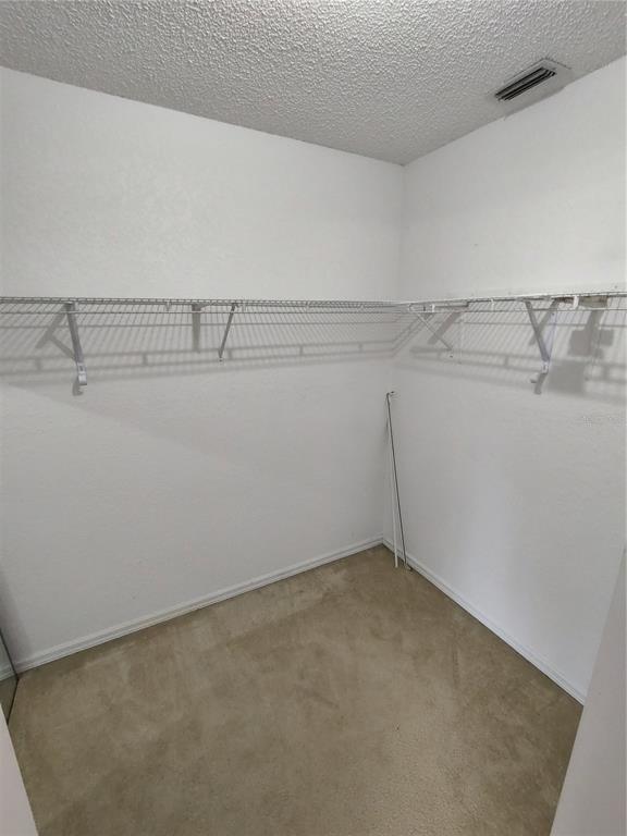 8792 Southwest 116th Place Road Ocala, FL 34481 - Photo 19 of 36 a view of a room with racks on the wall