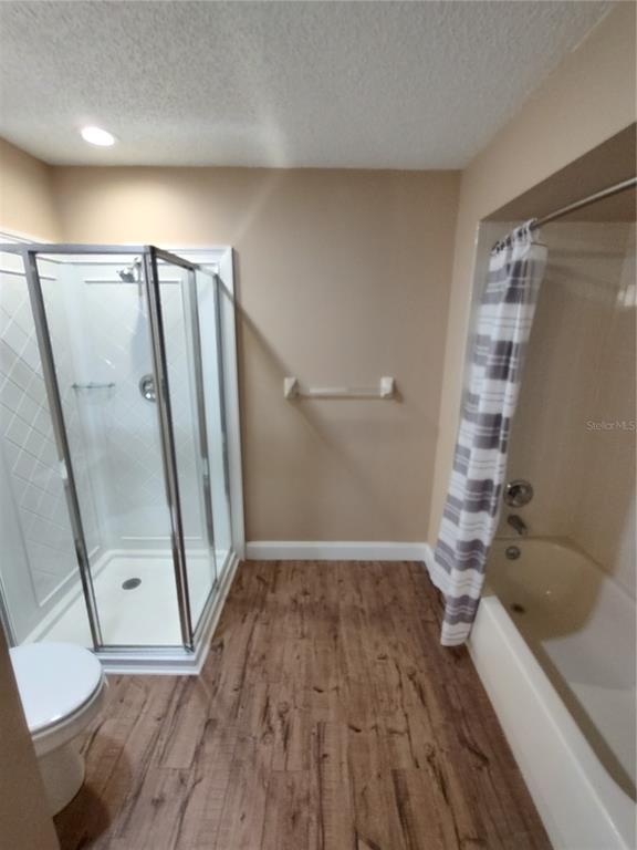 8792 Southwest 116th Place Road Ocala, FL 34481 - Photo 21 of 36 a view of a hallway with wooden floor and stairs