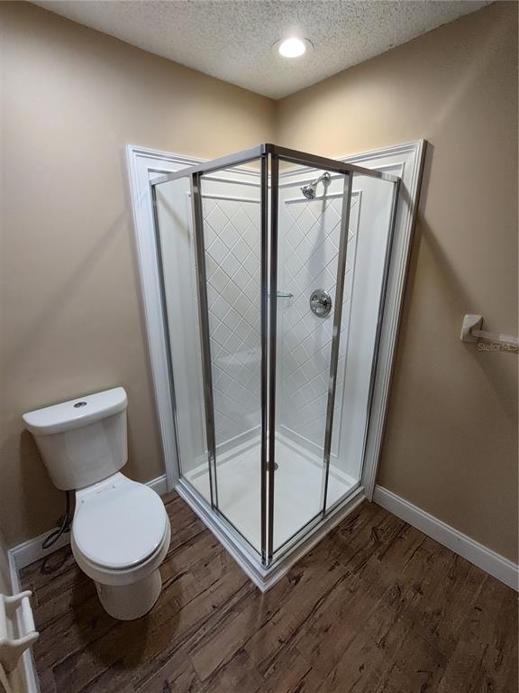 8792 Southwest 116th Place Road Ocala, FL 34481 - Photo 22 of 36 a bathroom with a toilet and a shower