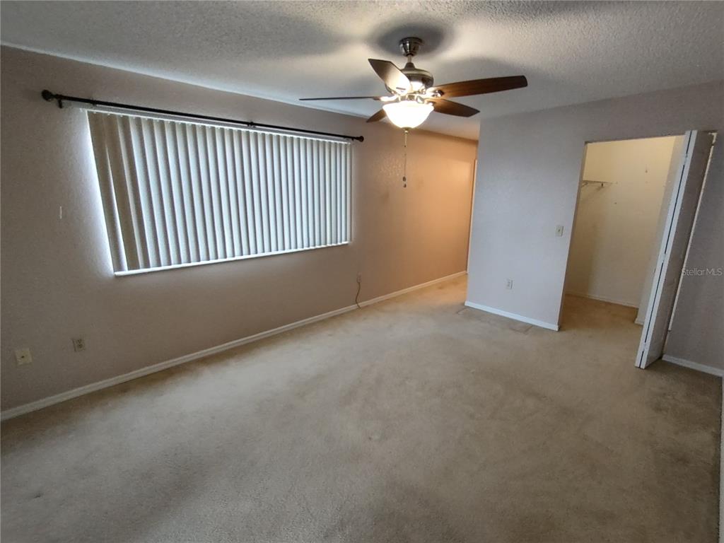 8792 Southwest 116th Place Road Ocala, FL 34481 - Photo 24 of 36 a view of an empty room with a window