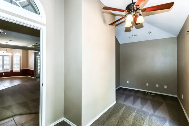 an empty room with fan