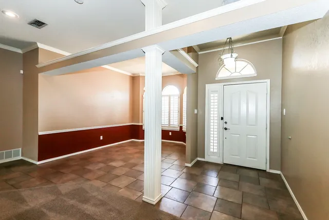 a view of a hallway with wooden shelves