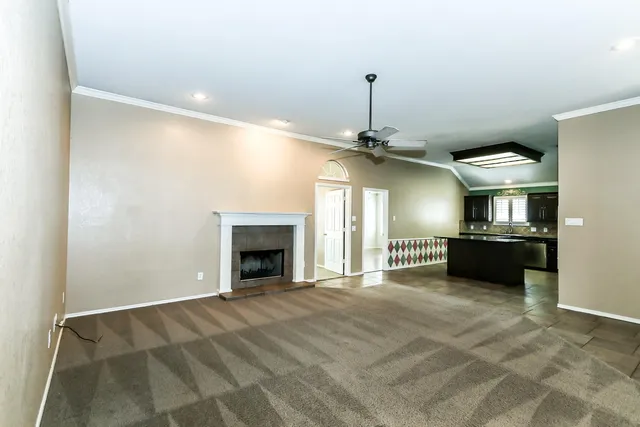 a view of a kitchen with a sink and a fireplace