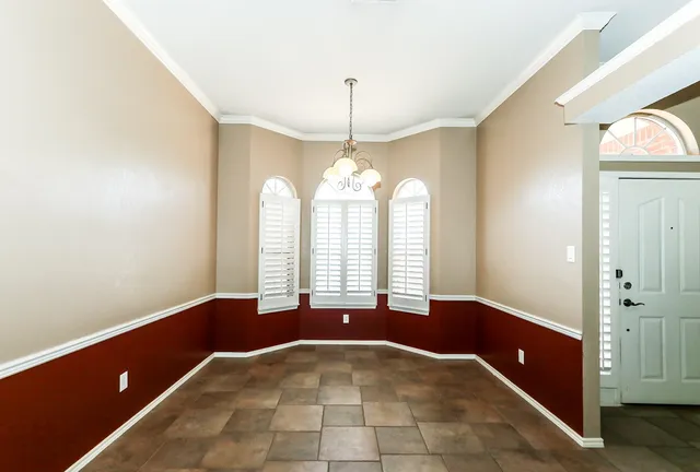 a view of a room with window and stairs