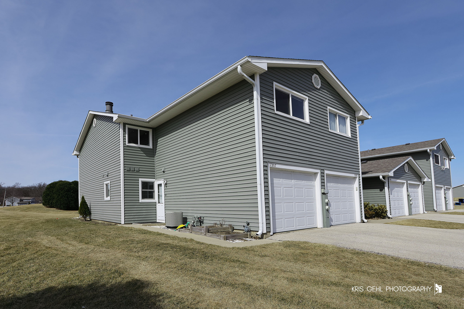 17307 Maple Lane, Unit F Gurnee, IL 60031 - Photo 1 of 21 a front view of a house with a garage