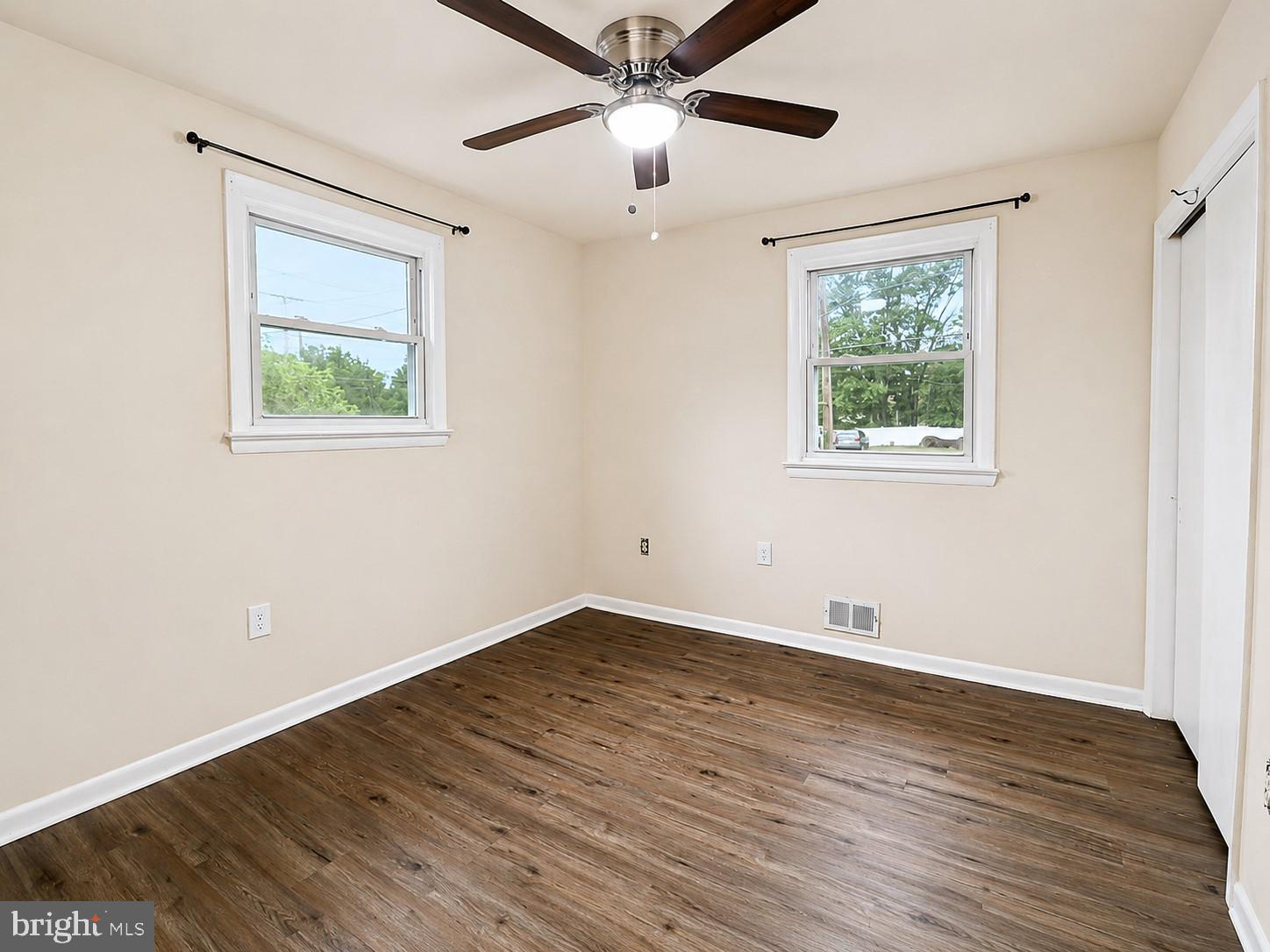 11312 Old Fort Road Fort Washington, MD 20744 - Photo 8 of 13 a view of an empty room with wooden floor and a window