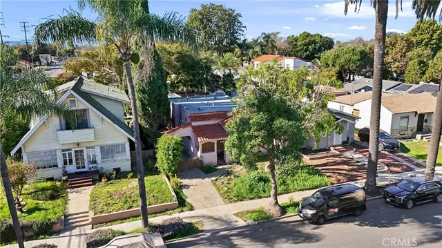 a view of multiple houses with a street